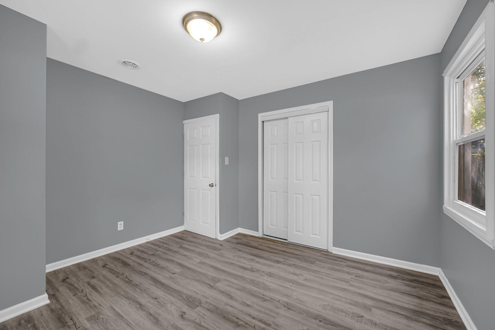 1159 Fayette Street Gary, IN 46403 - Photo 14 of 19 a view of room with window and wooden floor