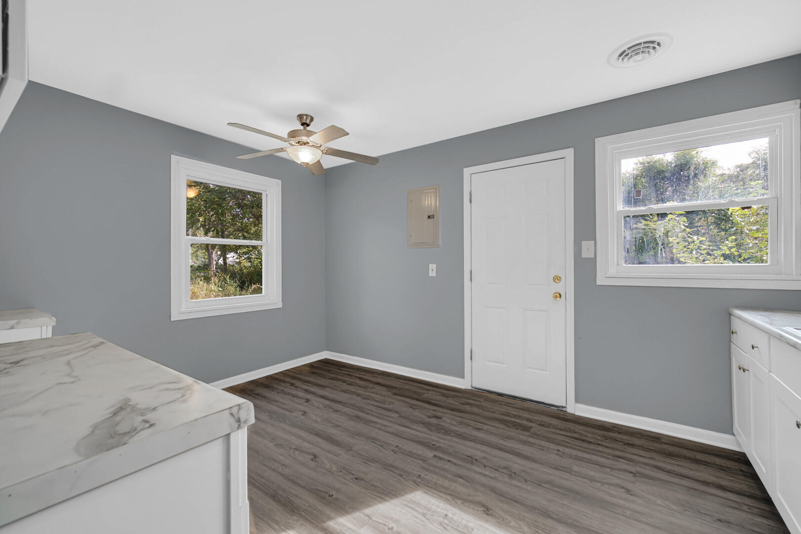 1159 Fayette Street Gary, IN 46403 - Photo 5 of 19 wooden floor in an empty room with a window