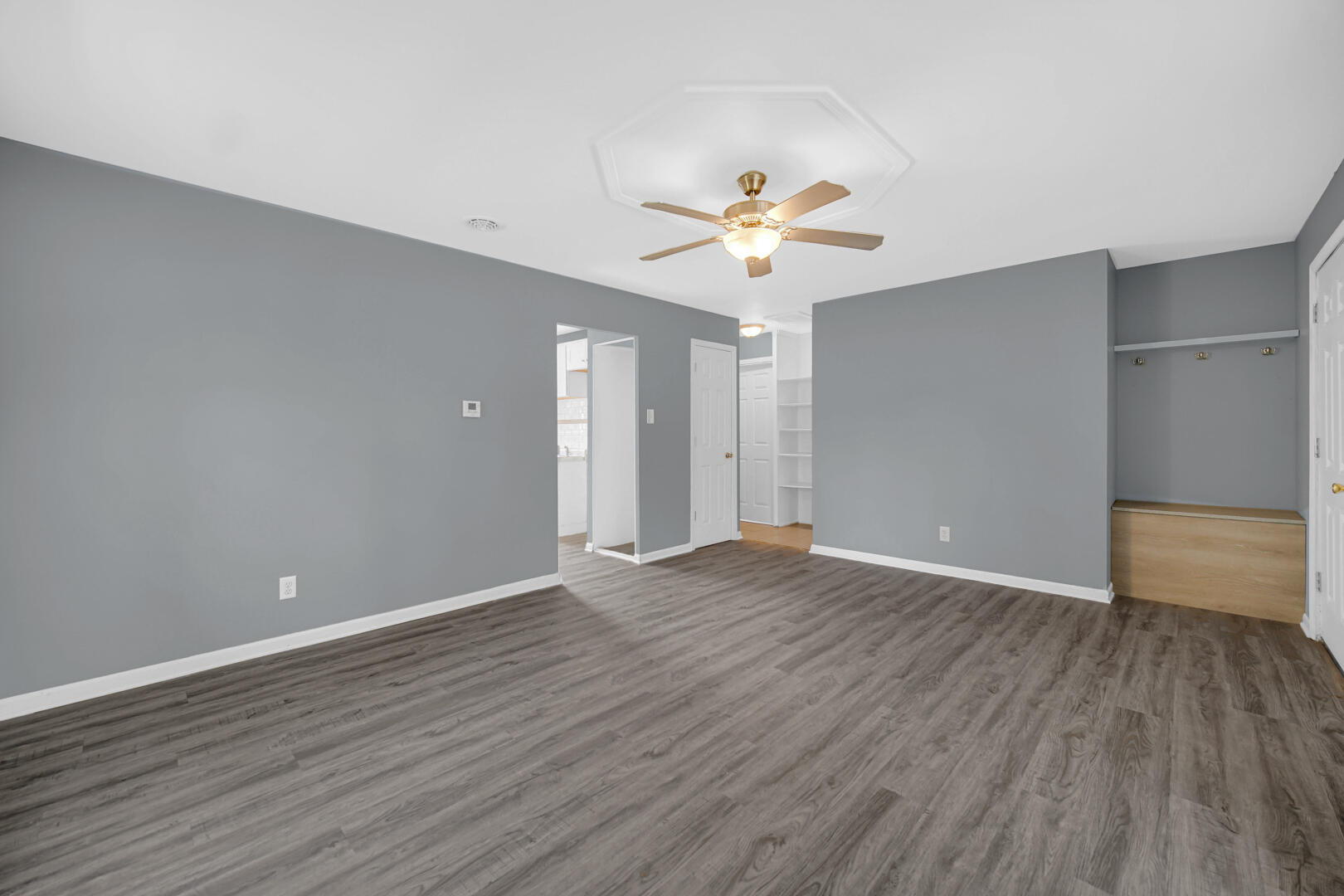 1159 Fayette Street Gary, IN 46403 - Photo 9 of 19 an empty room with wooden floor and ceiling fan