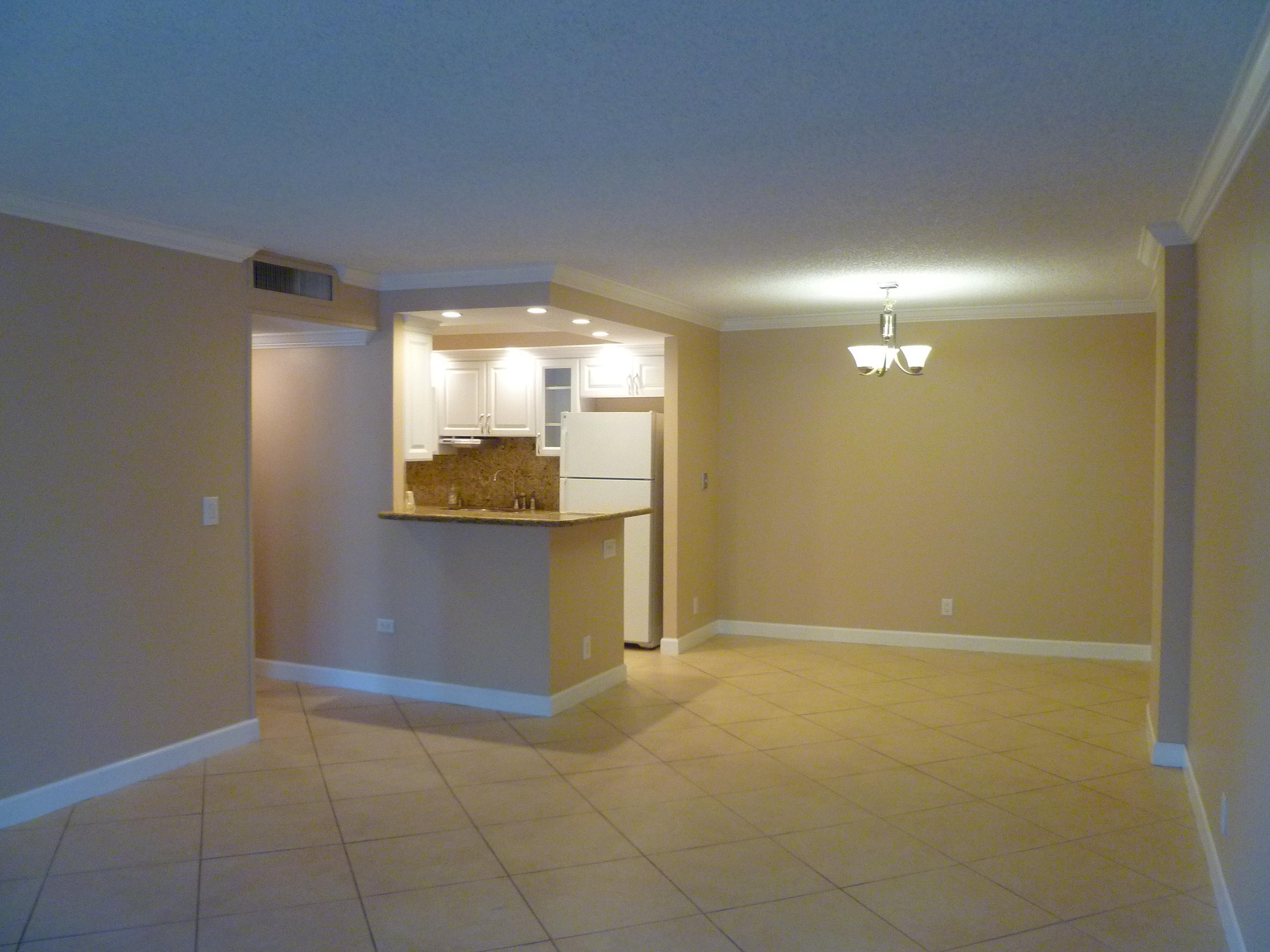 950 Ponce De Leon Road, Unit 104 Boca Raton, FL 33432 - Photo 12 of 33 a view of an empty room and window