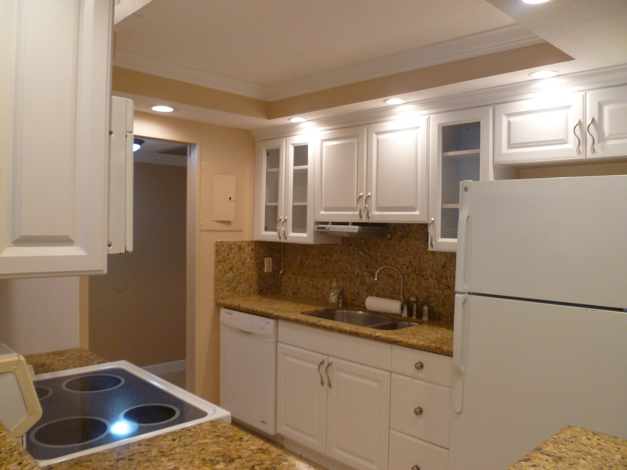 950 Ponce De Leon Road, Unit 104 Boca Raton, FL 33432 - Photo 15 of 33 a kitchen with a sink and refrigerator