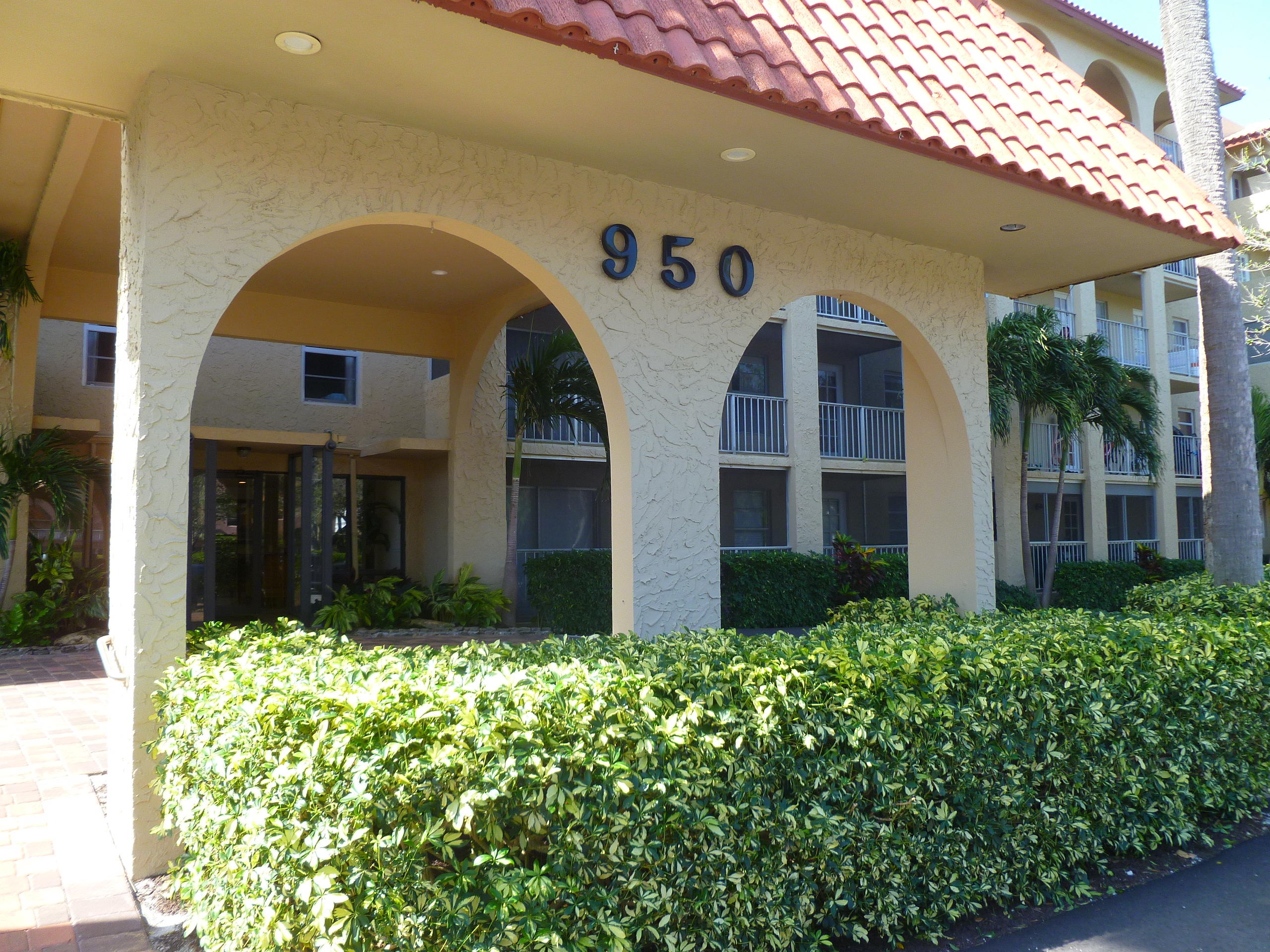 950 Ponce De Leon Road, Unit 104 Boca Raton, FL 33432 - Photo 2 of 33 a front view of house with yard