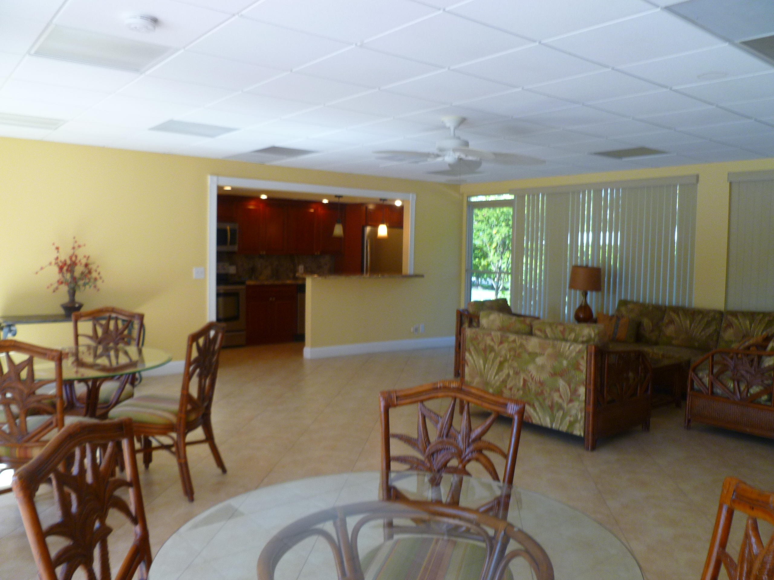 950 Ponce De Leon Road, Unit 104 Boca Raton, FL 33432 - Photo 10 of 33 a living room with furniture and a large window