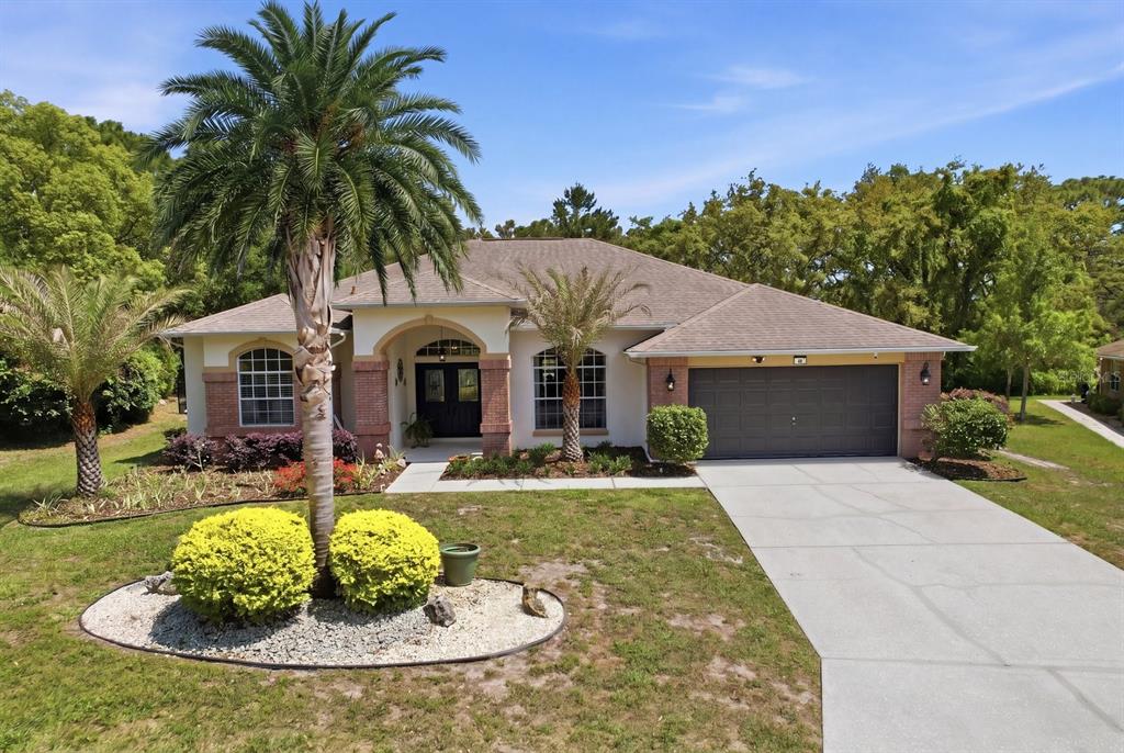 16 Calendula Court Homosassa, FL 34446 - Photo 1 of 50 a view of a house with swimming pool and a yard