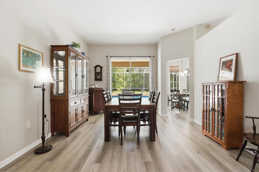 16 Calendula Court Homosassa, FL 34446 - Photo 11 of 50 a view of a dining room with furniture window and wooden floor