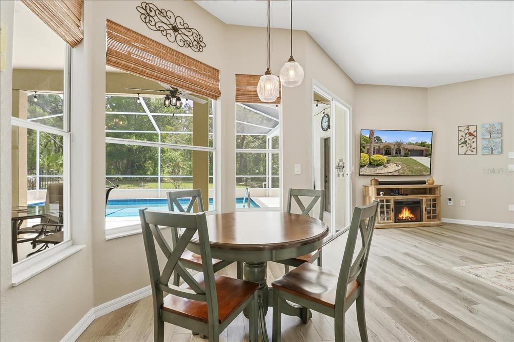 16 Calendula Court Homosassa, FL 34446 - Photo 12 of 50 a view of a dining room with furniture window and wooden floor
