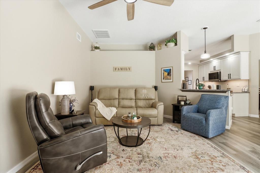 16 Calendula Court Homosassa, FL 34446 - Photo 17 of 50 a living room with furniture and a chandelier