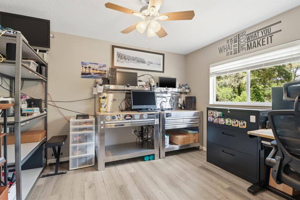16 Calendula Court Homosassa, FL 34446 - Photo 21 of 50 a kitchen with kitchen island a stove a refrigerator cabinets and a dining table