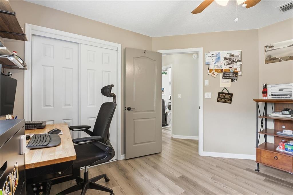 16 Calendula Court Homosassa, FL 34446 - Photo 22 of 50 a view of a workspace with furniture and wooden floor