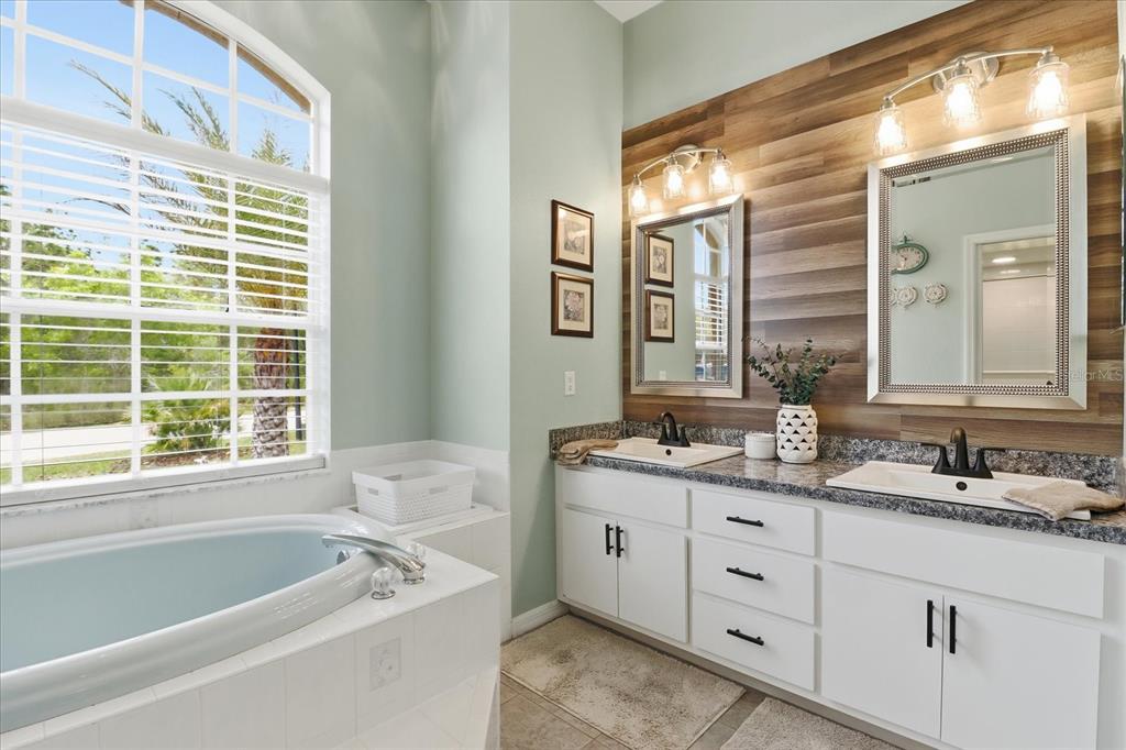 16 Calendula Court Homosassa, FL 34446 - Photo 29 of 50 a bathroom with a tub a sink and a window