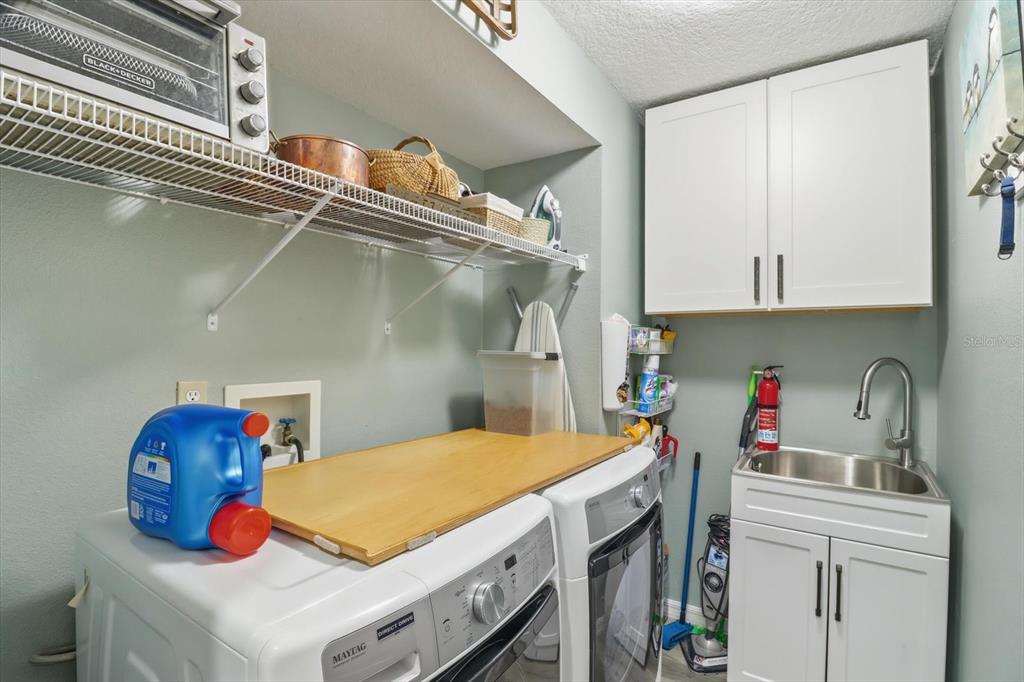 16 Calendula Court Homosassa, FL 34446 - Photo 32 of 50 a utility room with dryer and washer