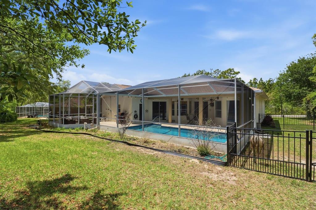 16 Calendula Court Homosassa, FL 34446 - Photo 40 of 50 a view of a house with swimming pool and sitting area