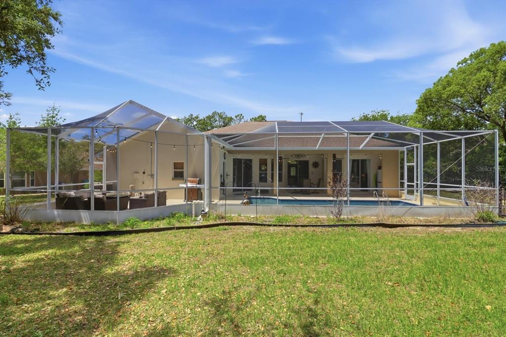 16 Calendula Court Homosassa, FL 34446 - Photo 41 of 50 a view of house with a big yard and large trees