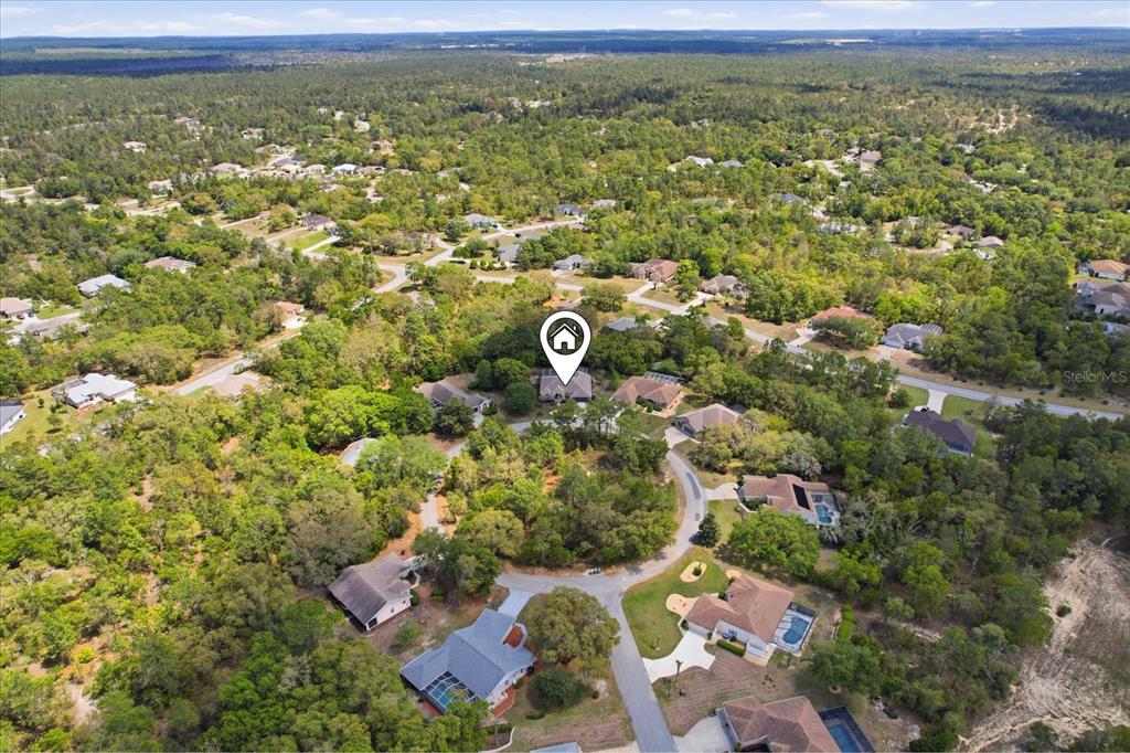 16 Calendula Court Homosassa, FL 34446 - Photo 42 of 50 an aerial view of residential houses with outdoor space and trees
