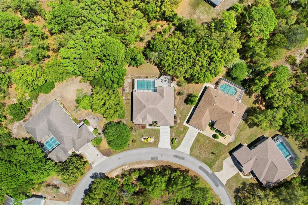 16 Calendula Court Homosassa, FL 34446 - Photo 44 of 50 an aerial view of a house with a yard basket ball court and outdoor seating