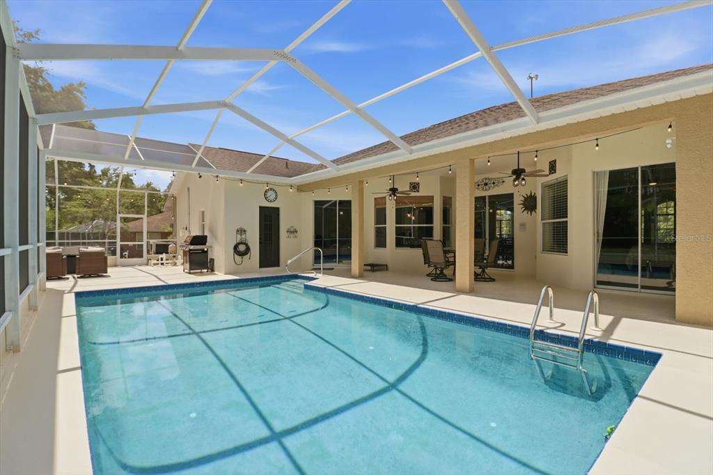 16 Calendula Court Homosassa, FL 34446 - Photo 45 of 50 a view of a patio with table and chairs