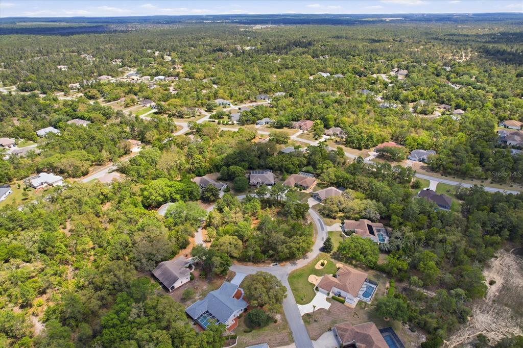 16 Calendula Court Homosassa, FL 34446 - Photo 47 of 50 an aerial view of residential houses with outdoor space and trees