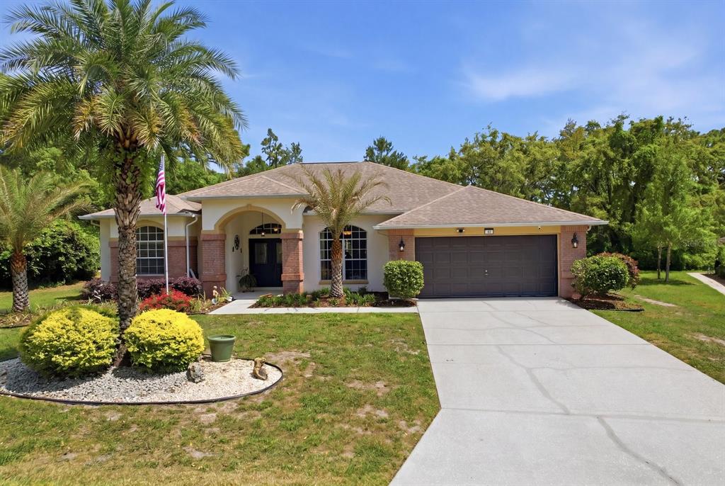 16 Calendula Court Homosassa, FL 34446 - Photo 49 of 50 a front view of a house with a yard