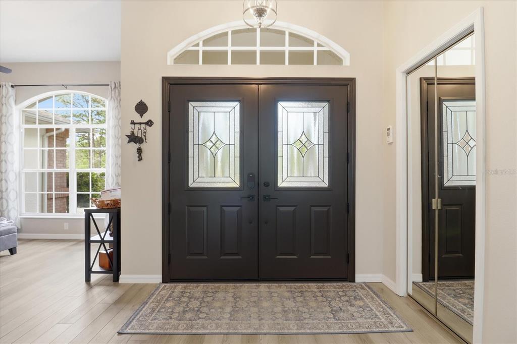16 Calendula Court Homosassa, FL 34446 - Photo 8 of 50 a view of a entryway door with wooden floor