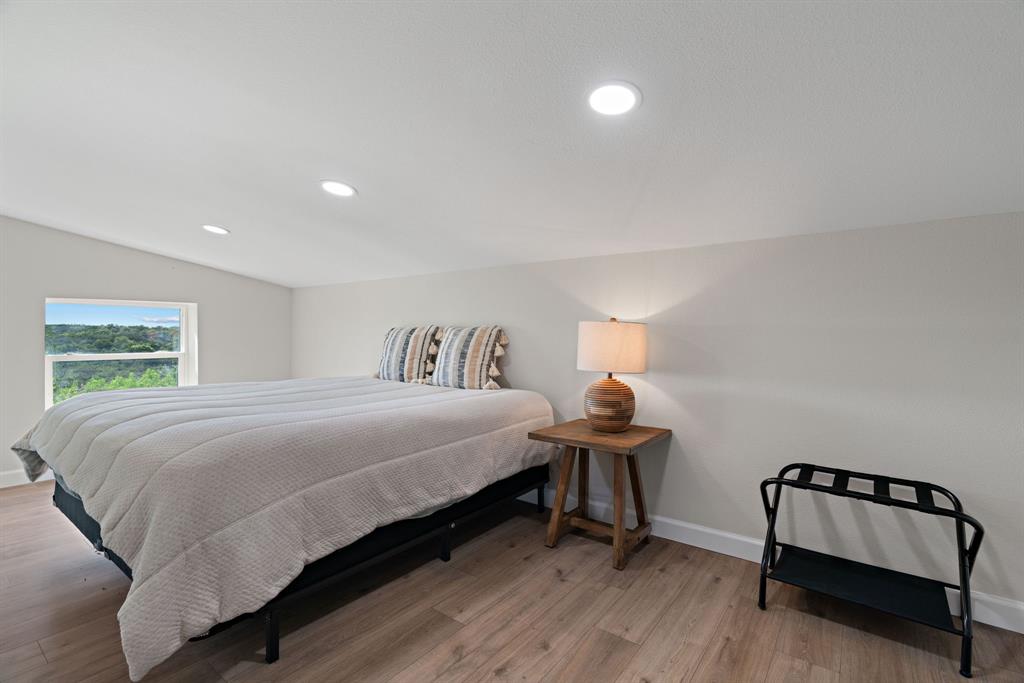 5410 Buffalo Ridge Drive Stephenville, TX 76401 - Photo 22 of 40 a bedroom with a bed and window