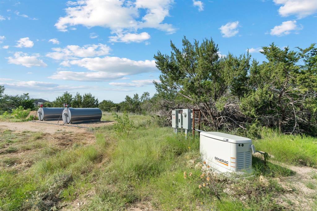 5410 Buffalo Ridge Drive Stephenville, TX 76401 - Photo 29 of 40 a backyard of a house with lots of green space