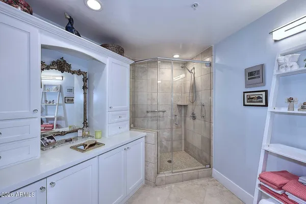 a view of a dining room with furniture a chandelier and wooden floor