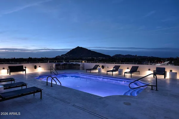 a view of a swimming pool with a patio