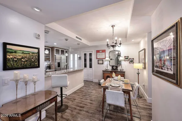 a kitchen with stainless steel appliances granite countertop a sink and cabinets