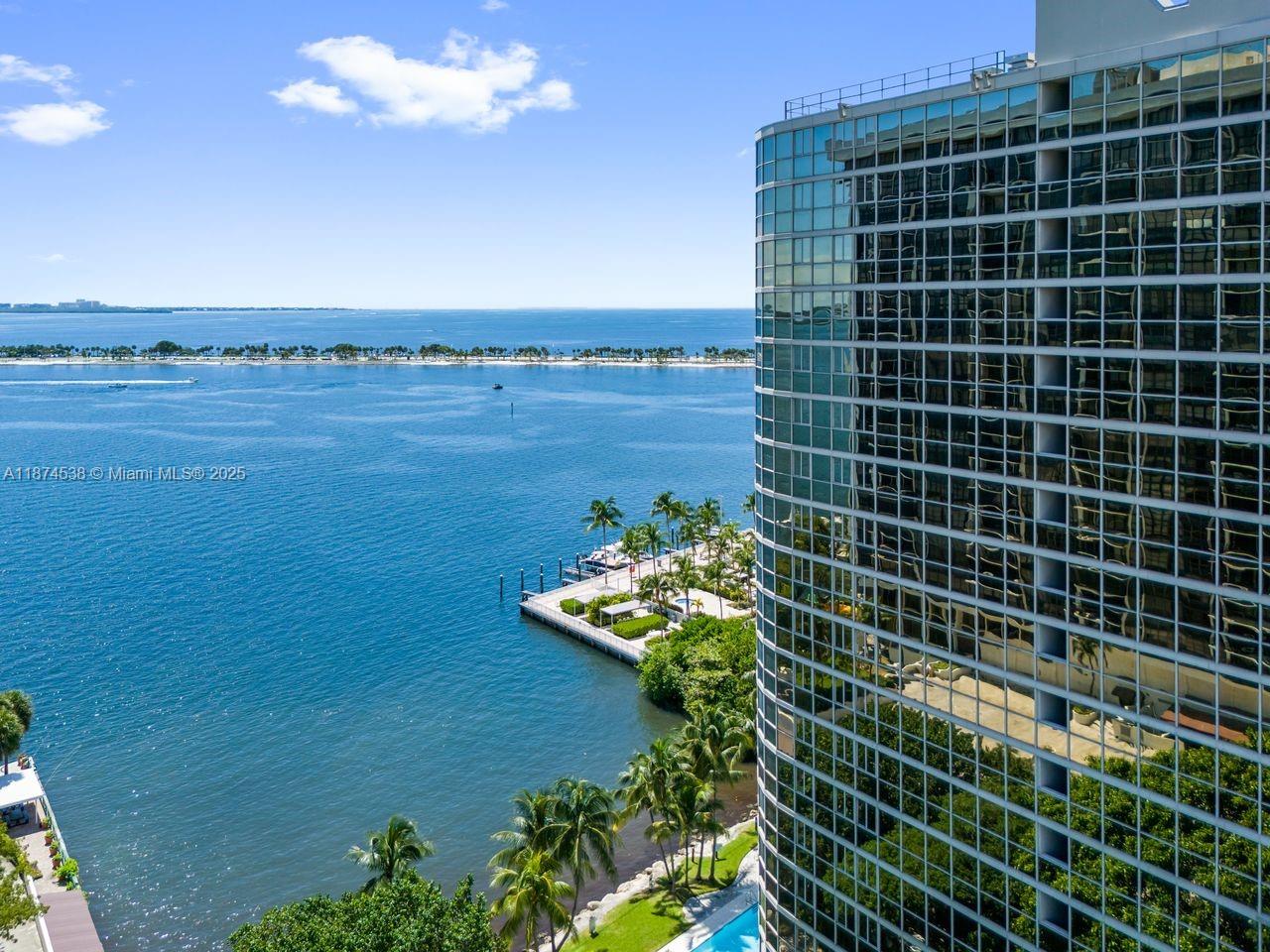 2025 Brickell Avenue, Unit 1705 Miami, FL 33129 - Photo 1 of 50 a bathroom with a shower curtain and a mirror