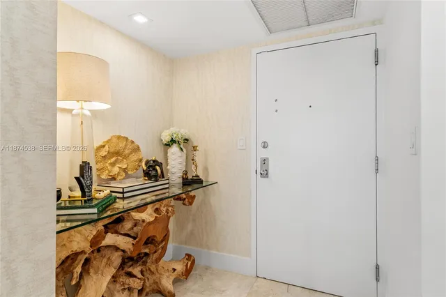 a view of bathroom with a mirror