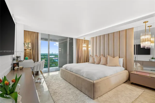 a bedroom with a large bed and a large window