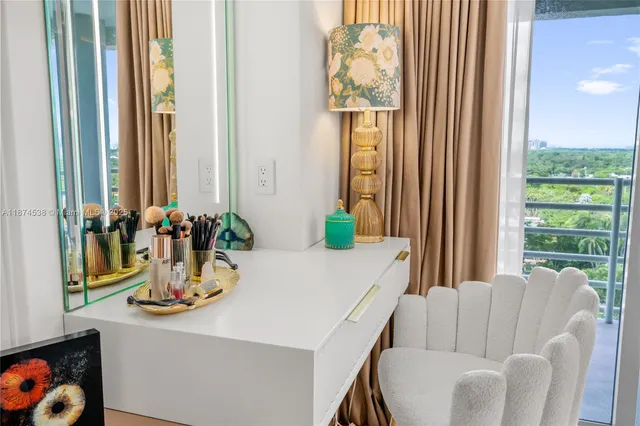 a dining room with furniture and a window