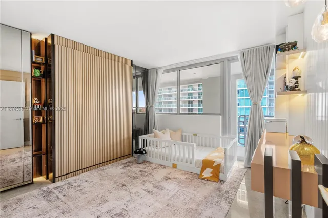 a bedroom with furniture and a window