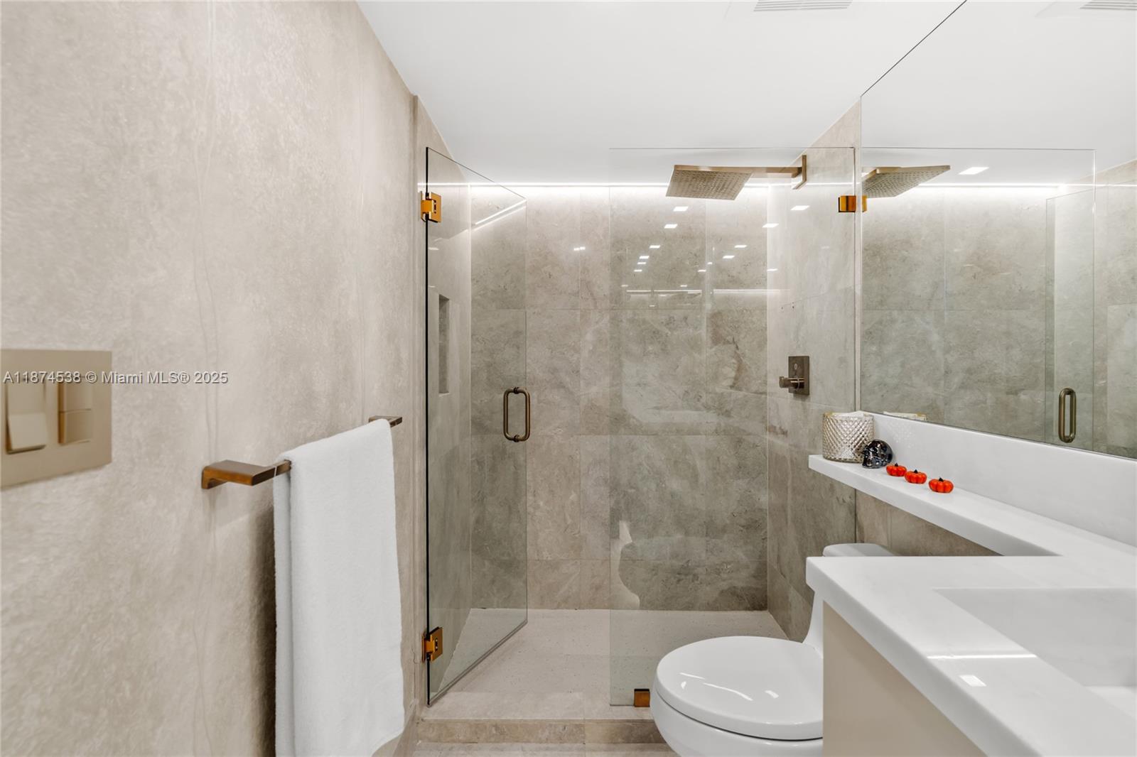 2025 Brickell Avenue, Unit 1705 Miami, FL 33129 - Photo 26 of 50 a bathroom with a shower and a toilet