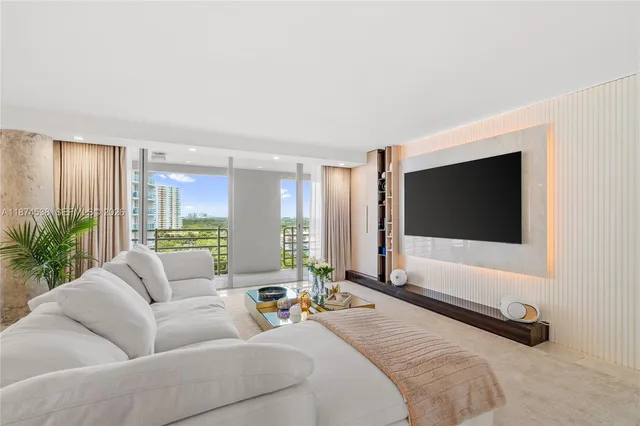 a bedroom with furniture and a flat screen tv