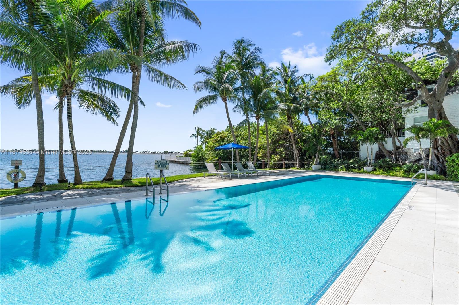 2025 Brickell Avenue, Unit 1705 Miami, FL 33129 - Photo 35 of 50 a view of swimming pool with a table and chairs