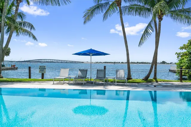 a view of swimming pool with chairs