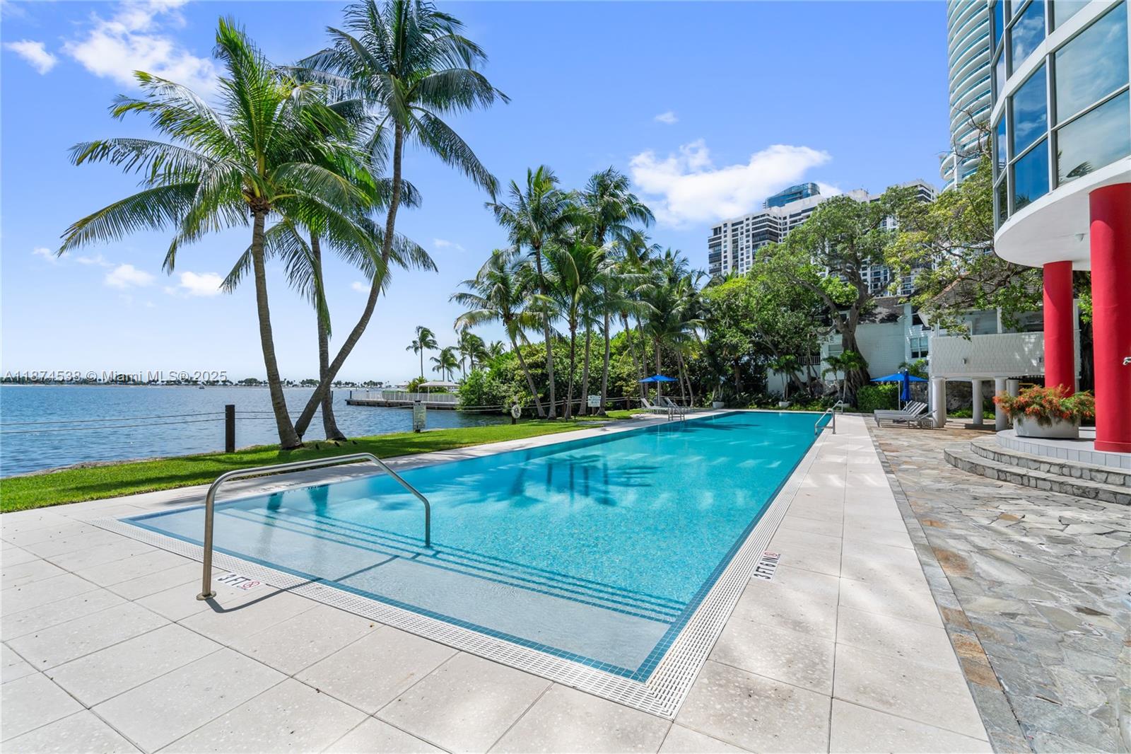 2025 Brickell Avenue, Unit 1705 Miami, FL 33129 - Photo 38 of 50 a view of swimming pool with a yard and palm trees