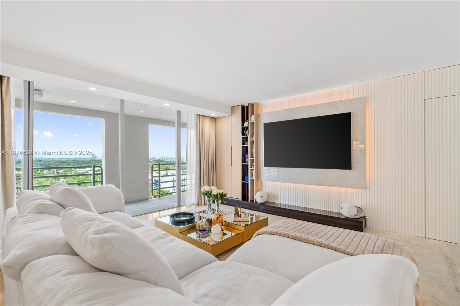 2025 Brickell Avenue, Unit 1705 Miami, FL 33129 - Photo 4 of 50 a living room with furniture and a flat screen tv