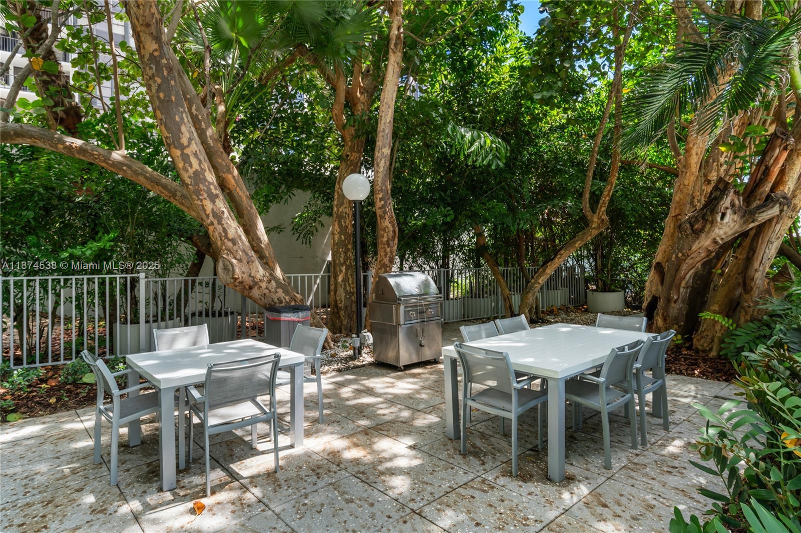 2025 Brickell Avenue, Unit 1705 Miami, FL 33129 - Photo 43 of 50 a view of a table and chairs in the patio