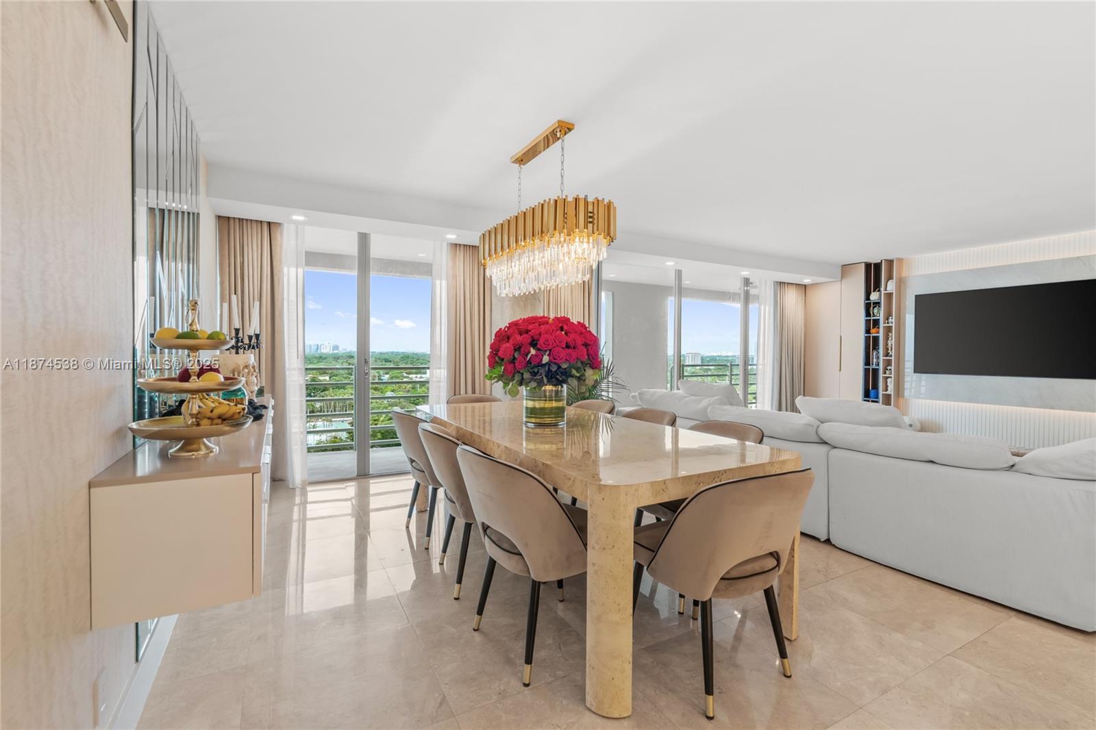 2025 Brickell Avenue, Unit 1705 Miami, FL 33129 - Photo 7 of 50 a view of a dining room with furniture and chandelier