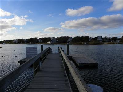 33 Nehoiden Road Mashpee, MA 02649 - Photo 8 of 12 a view of a balcony with wooden floor and lake view