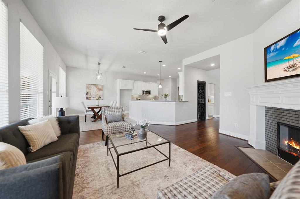 3475 Pilgrim Drive Frisco, TX 75034 - Photo 11 of 33 a living room with furniture and a fireplace