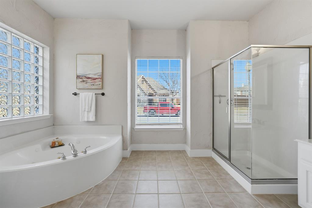 3475 Pilgrim Drive Frisco, TX 75034 - Photo 22 of 33 a bathroom with a bathtub and a shower