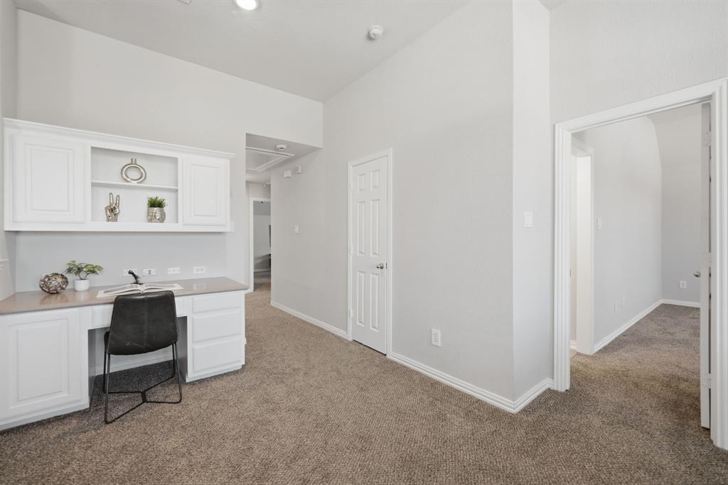 3475 Pilgrim Drive Frisco, TX 75034 - Photo 23 of 33 a workspace with a wooden cabinet and bathroom