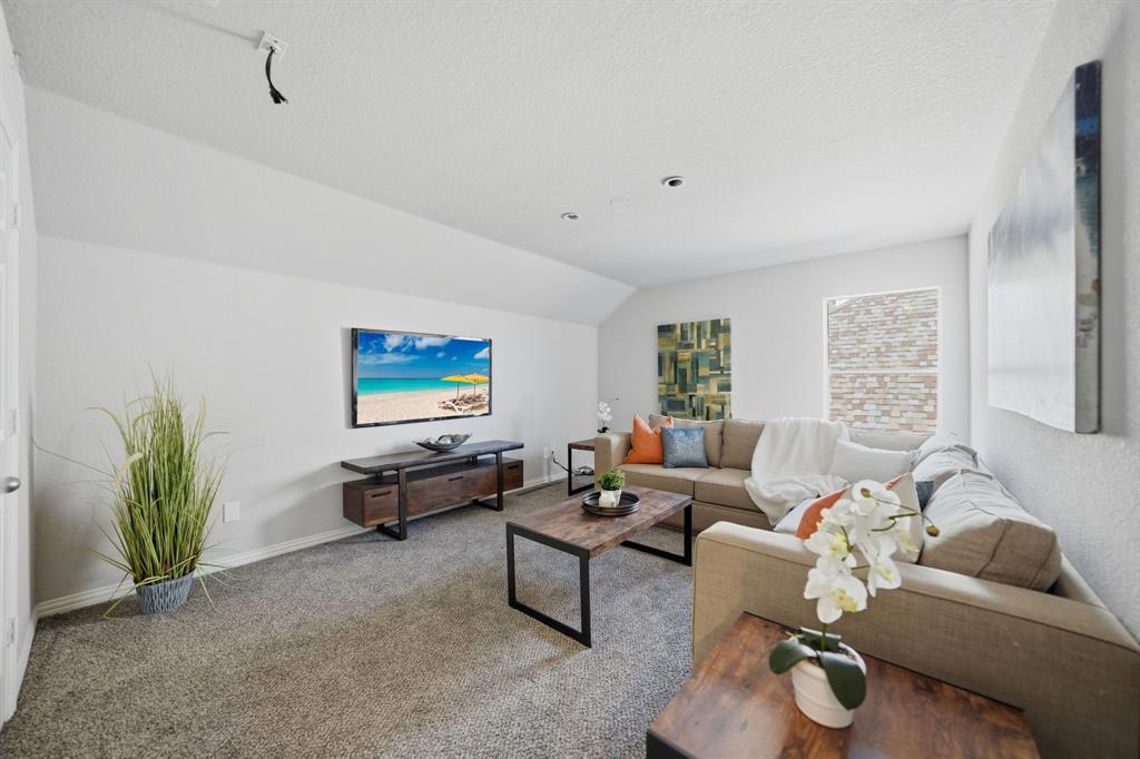 3475 Pilgrim Drive Frisco, TX 75034 - Photo 27 of 33 a living room with furniture and a rug