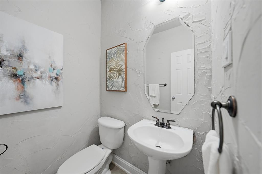 3475 Pilgrim Drive Frisco, TX 75034 - Photo 7 of 33 a bathroom with a sink mirror and toilet