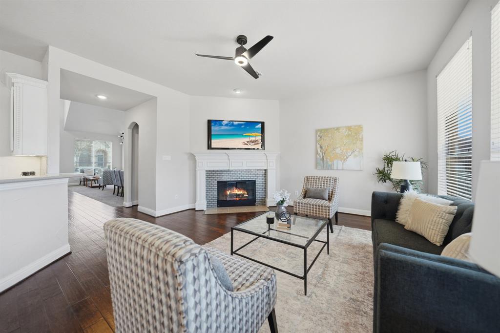 3475 Pilgrim Drive Frisco, TX 75034 - Photo 10 of 33 a living room with furniture and a fireplace