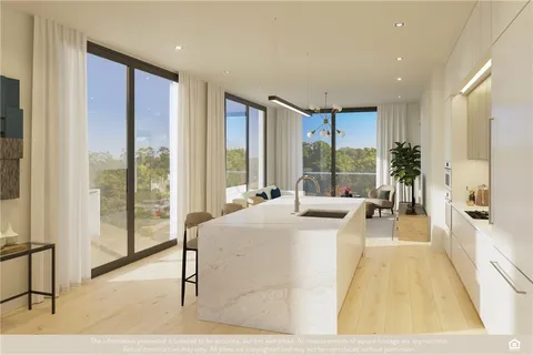 a living room with large windows and a table