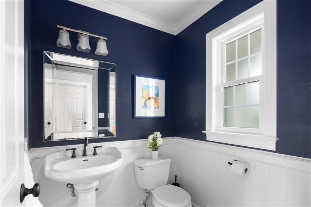 88 Jedediah's Path Marshfield, MA 02050 - Photo 16 of 41 a bathroom with a sink a toilet and a mirror